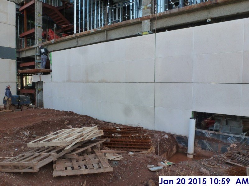 Installing stone panels at the North Elevation